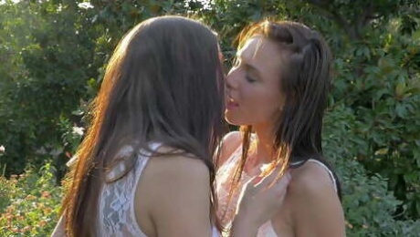 Lesbian love outdoors from two sexy and hot college girls