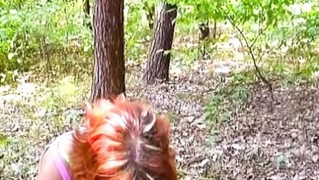 Redhead whore from Germany eating cum in the middle of the woods