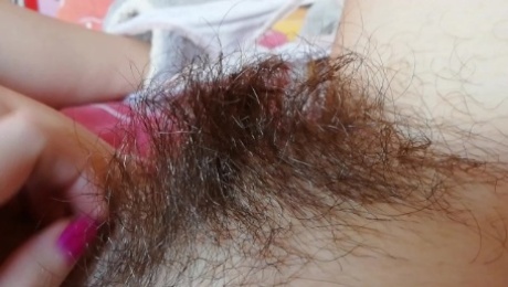 Playing with my thick hairy bush big clit pussy close up